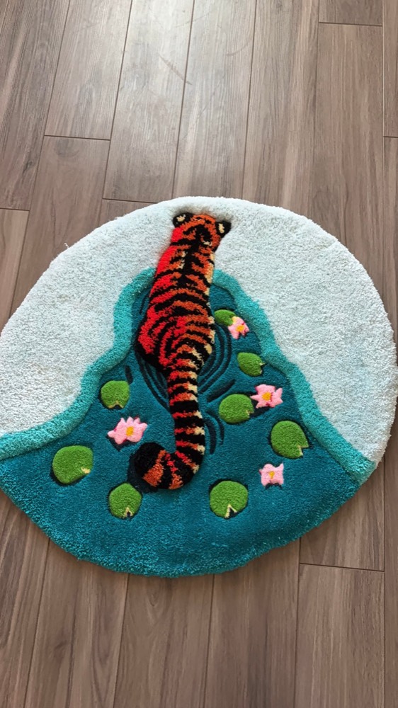 Tiger in a Pond rug — a carved 3D tiger in teal water with lily pads