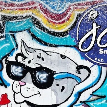 The JJ's snow leopard mural in sunglasses
